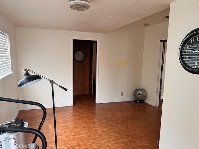 1423 S Poinsettia Ave, Compton, CA 90221 - exercise room featuring wood finished floors and baseboards