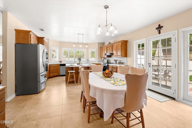 2210 Via Loma, Camarillo, CA 93012 - dining area with light tile patterned flooring and a chandelier