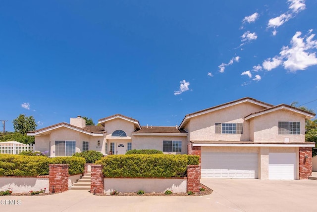 2210 Via Loma, Camarillo, CA 93012 - view of front of property featuring stucco siding, a garage, driveway, and a chimney
