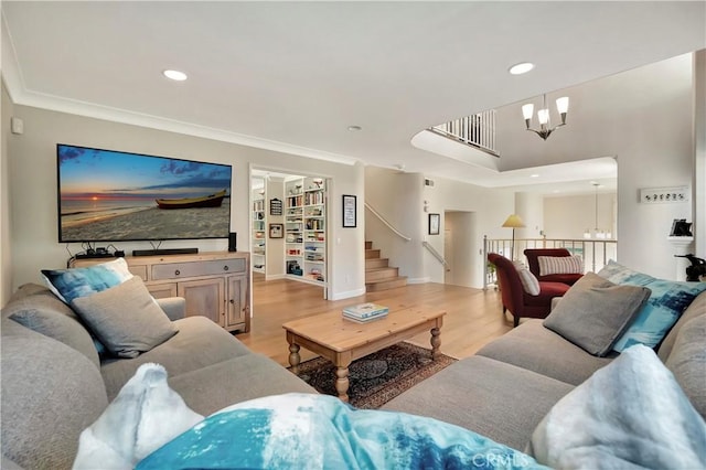 living area featuring light wood-style flooring, recessed lighting, and a notable chandelier
