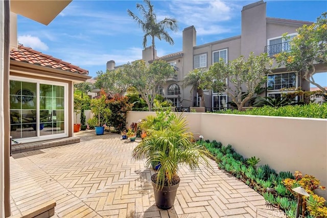 view of patio featuring fence