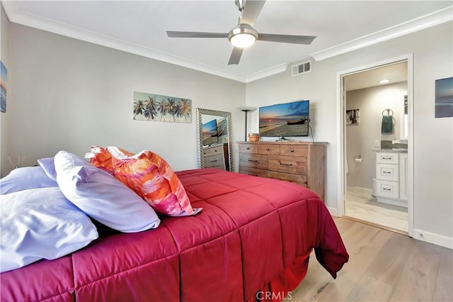 bedroom featuring visible vents, a ceiling fan, wood finished floors, crown molding, and ensuite bath