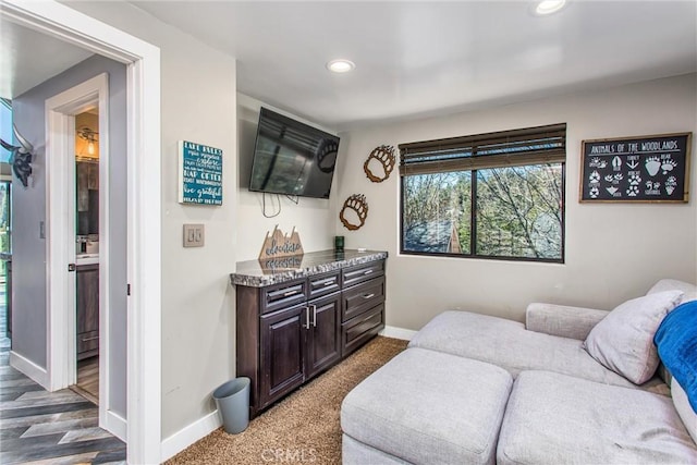 sitting room featuring baseboards and recessed lighting