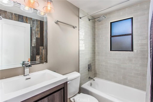 bathroom with vanity,  shower combination, and toilet