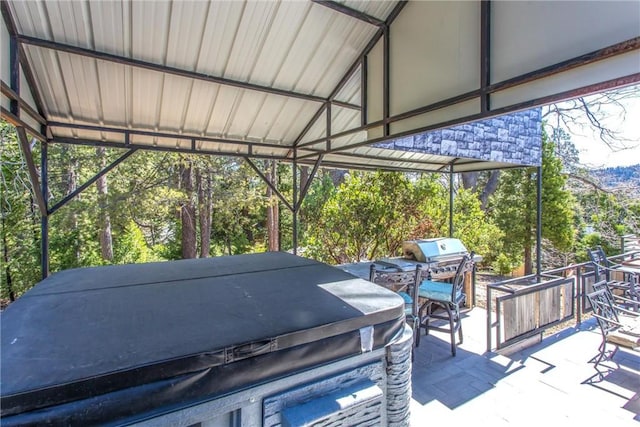 view of patio / terrace featuring a hot tub