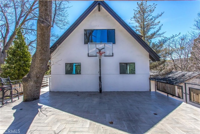 exterior space with a patio and stucco siding