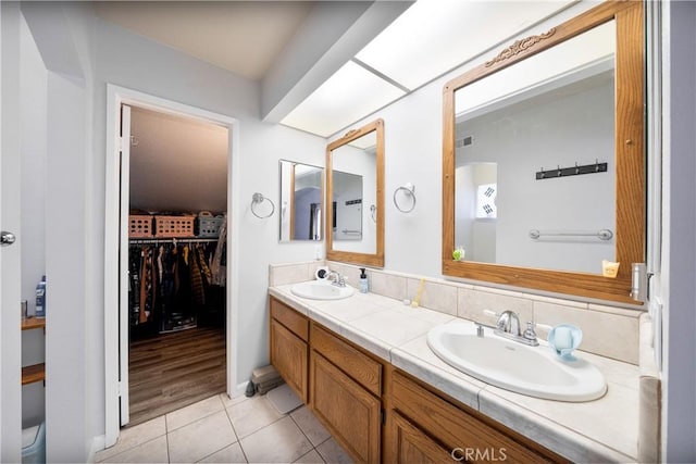 39240 Gunsmoke Ct, Palmdale, CA 93551 - bathroom featuring double vanity, visible vents, tile patterned flooring, and a sink