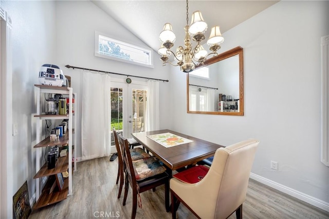39240 Gunsmoke Ct, Palmdale, CA 93551 - dining area featuring a chandelier, high vaulted ceiling, baseboards, french doors, and wood finished floors