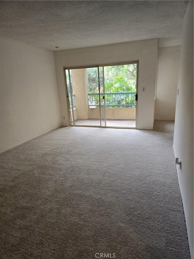 18307 Burbank Blvd Unit 7, Tarzana, CA 91356 - unfurnished room featuring carpet flooring and a textured ceiling