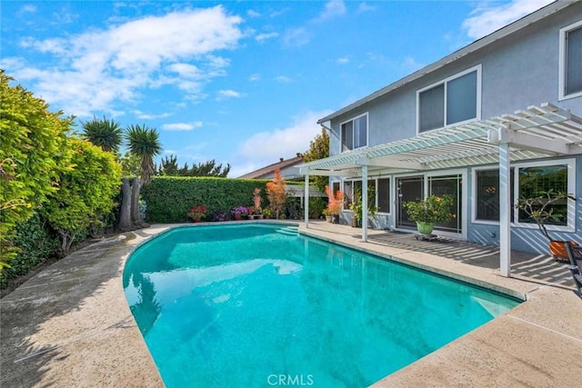 view of pool with a pergola, a patio area, and a fenced backyard