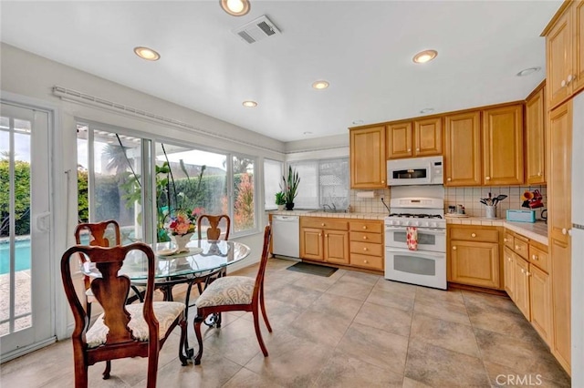 937 Carnation Ave, Costa Mesa, CA 92626 - kitchen with white appliances, healthy amount of natural light, tasteful backsplash, and recessed lighting