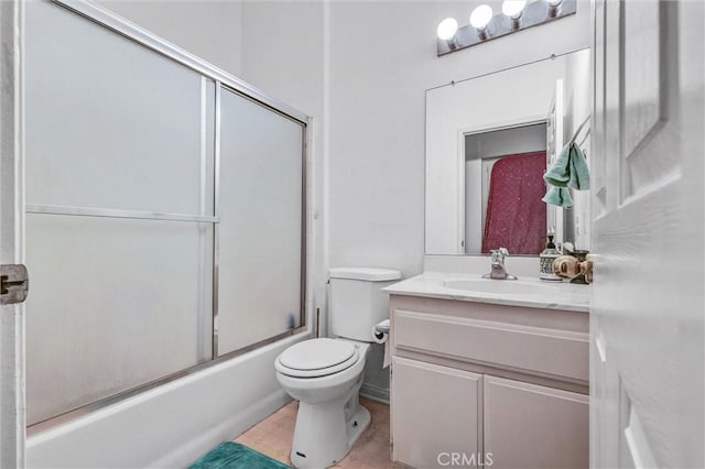 6845 Shubin Ln, Whittier, CA 90606 - full bathroom with tile patterned flooring, toilet, vanity, and bath / shower combo with glass door