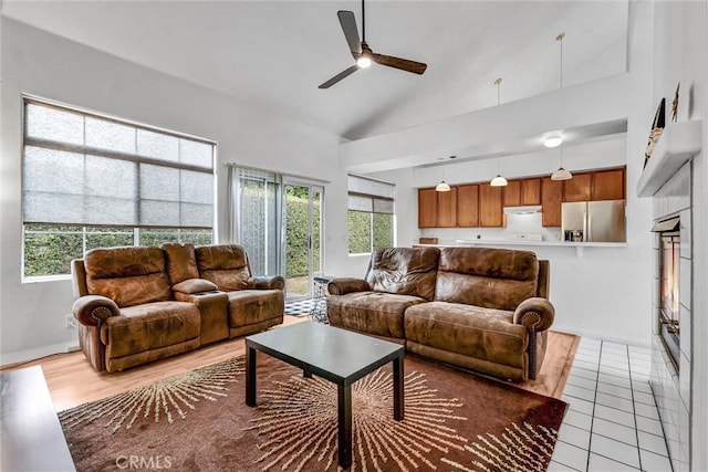 6845 Shubin Ln, Whittier, CA 90606 - living area with baseboards, a healthy amount of sunlight, high vaulted ceiling, and ceiling fan