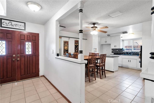 1844 Alston Ave, Colton, CA 92324 - foyer featuring a textured ceiling, light tile patterned flooring, and ceiling fan