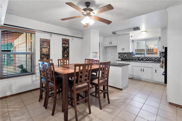 1844 Alston Ave, Colton, CA 92324 - dining area featuring a textured ceiling, a ceiling fan, and light tile patterned flooring
