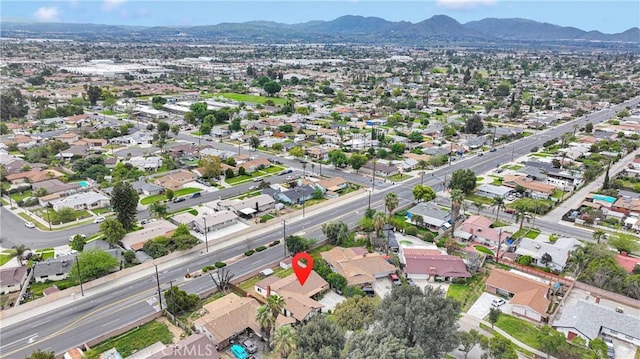 1844 Alston Ave, Colton, CA 92324 - aerial overview of property's location featuring a mountainous background and nearby suburban area