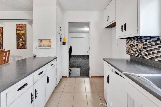1844 Alston Ave, Colton, CA 92324 - kitchen featuring dark countertops, white cabinetry, backsplash, and light tile patterned floors