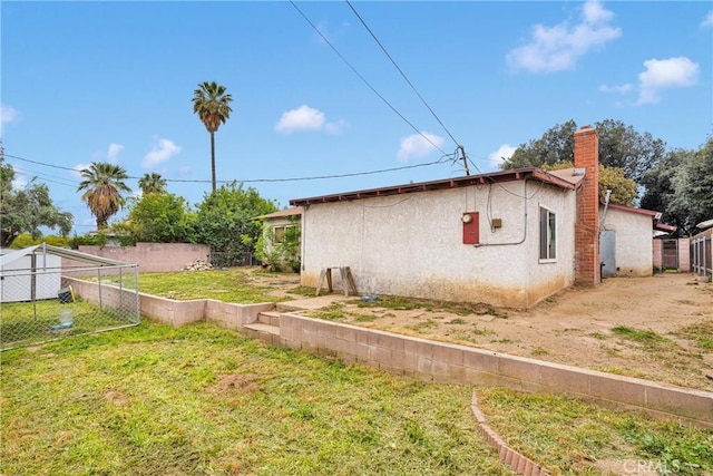 1844 Alston Ave, Colton, CA 92324 - view of property exterior featuring stucco siding and a chimney