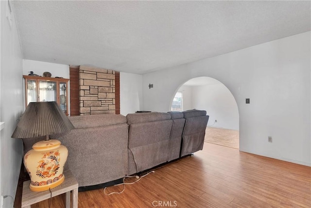1844 Alston Ave, Colton, CA 92324 - living room with arched walkways and wood finished floors