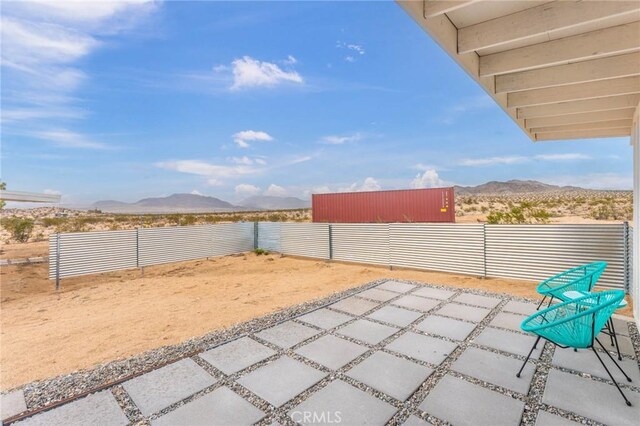 52024 Nehlsen Rd, Johnson Valley, CA 92285 - view of patio featuring fence and a mountain view
