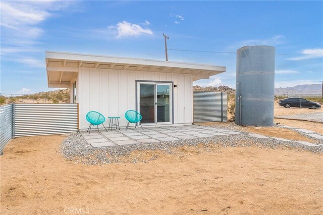 52024 Nehlsen Rd, Johnson Valley, CA 92285 - rear view of property featuring fence and board and batten siding