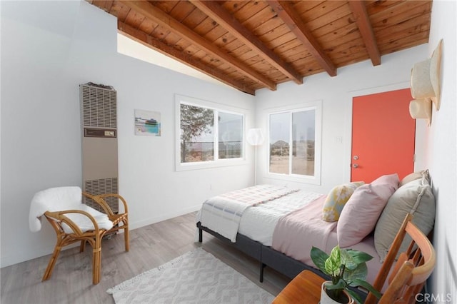 52024 Nehlsen Rd, Johnson Valley, CA 92285 - bedroom featuring a heating unit, vaulted ceiling with beams, baseboards, light wood-style floors, and wooden ceiling