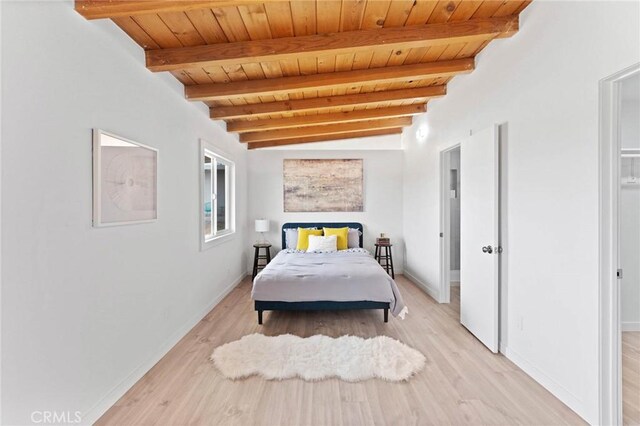 52024 Nehlsen Rd, Johnson Valley, CA 92285 - bedroom with baseboards, beam ceiling, light wood finished floors, and wood ceiling
