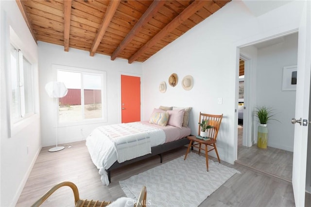 52024 Nehlsen Rd, Johnson Valley, CA 92285 - bedroom featuring baseboards, wood finished floors, vaulted ceiling with beams, and wooden ceiling