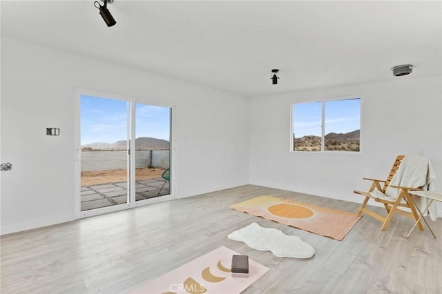52024 Nehlsen Rd, Johnson Valley, CA 92285 - sitting room featuring plenty of natural light and wood finished floors