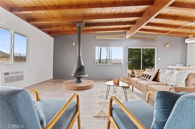 52024 Nehlsen Rd, Johnson Valley, CA 92285 - living room featuring beamed ceiling, wooden ceiling, a wall mounted AC, and a wood stove