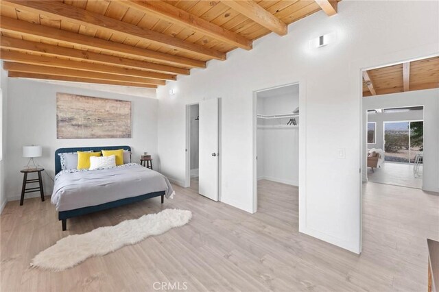 52024 Nehlsen Rd, Johnson Valley, CA 92285 - bedroom featuring wood finished floors, a spacious closet, wood ceiling, baseboards, and beam ceiling