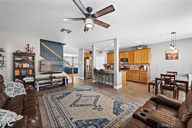 5332 Trailhawk Ave, Fontana, CA 92336 - living area featuring visible vents, stairway, recessed lighting, a ceiling fan, and light wood-style flooring
