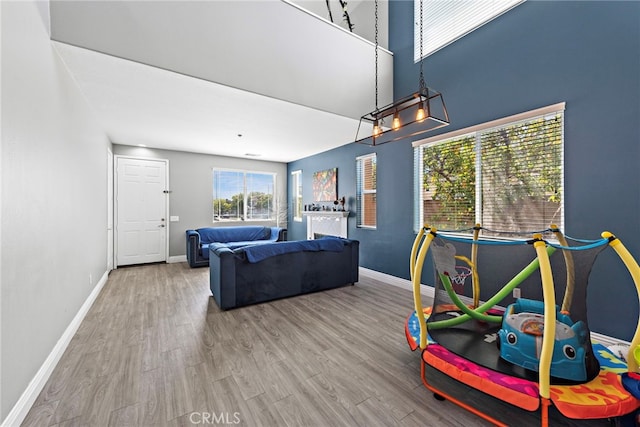 5332 Trailhawk Ave, Fontana, CA 92336 - game room with baseboards and wood finished floors