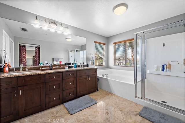 5332 Trailhawk Ave, Fontana, CA 92336 - full bath featuring a sink, double vanity, a stall shower, and a garden tub
