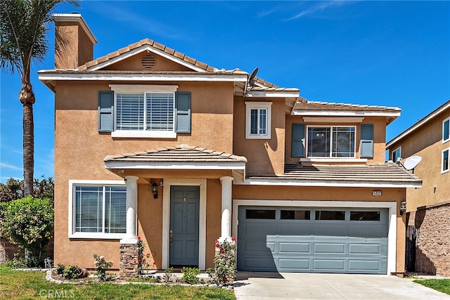 5332 Trailhawk Ave, Fontana, CA 92336 - traditional home featuring an attached garage, stucco siding, a tile roof, and concrete driveway