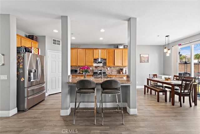5332 Trailhawk Ave, Fontana, CA 92336 - kitchen with stone countertops, appliances with stainless steel finishes, a sink, and visible vents