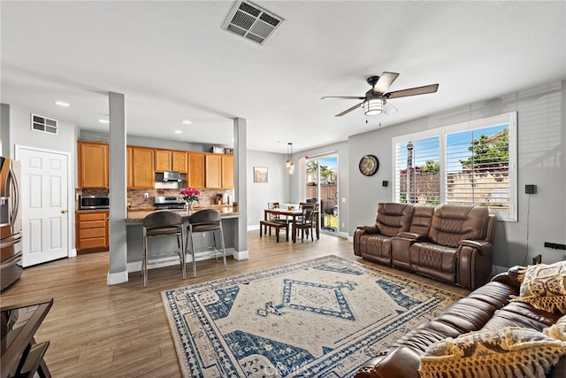 5332 Trailhawk Ave, Fontana, CA 92336 - living area with visible vents, recessed lighting, light wood-style flooring, and ceiling fan