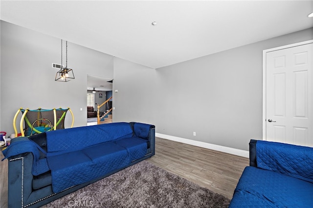 5332 Trailhawk Ave, Fontana, CA 92336 - living area featuring stairs, baseboards, and wood finished floors