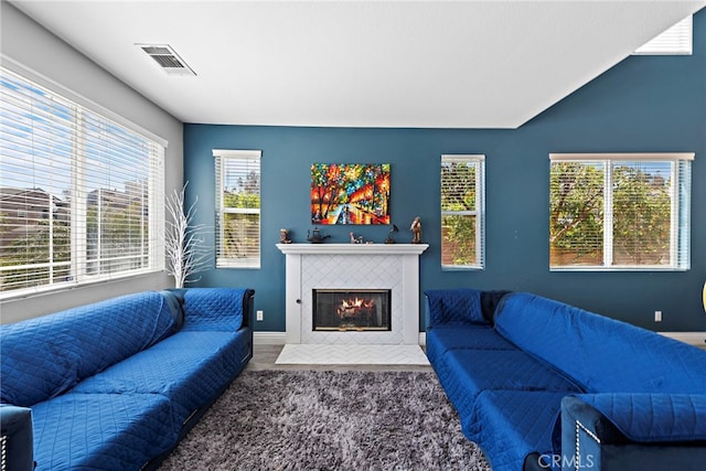 5332 Trailhawk Ave, Fontana, CA 92336 - living room featuring baseboards, a fireplace, and visible vents