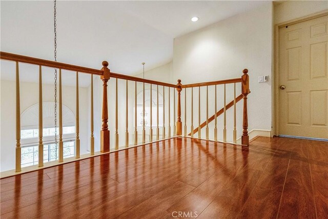 interior space with recessed lighting, baseboards, and wood finished floors