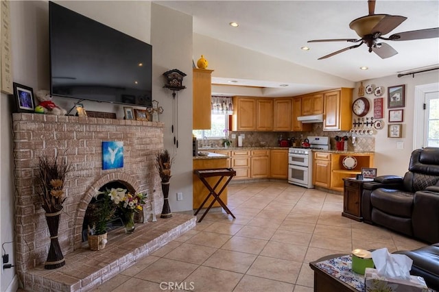 1709 S Helen Ave, Ontario, CA 91762 - living area with lofted ceiling, plenty of natural light, a ceiling fan, and light tile patterned flooring