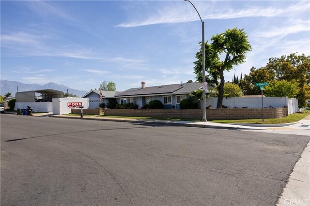 1709 S Helen Ave, Ontario, CA 91762 - single story home with a mountain view, a carport, and fence