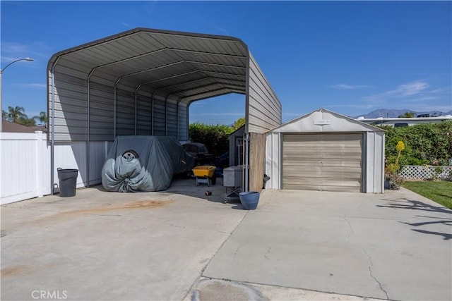 1709 S Helen Ave, Ontario, CA 91762 - view of vehicle parking featuring fence, driveway, a carport, and a garage