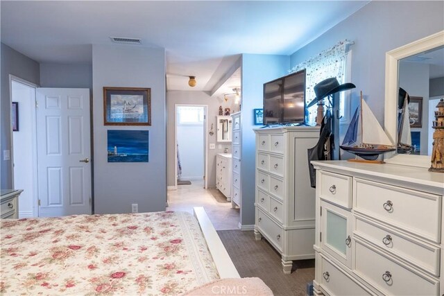 1709 S Helen Ave, Ontario, CA 91762 - bedroom with baseboards, visible vents, and connected bathroom