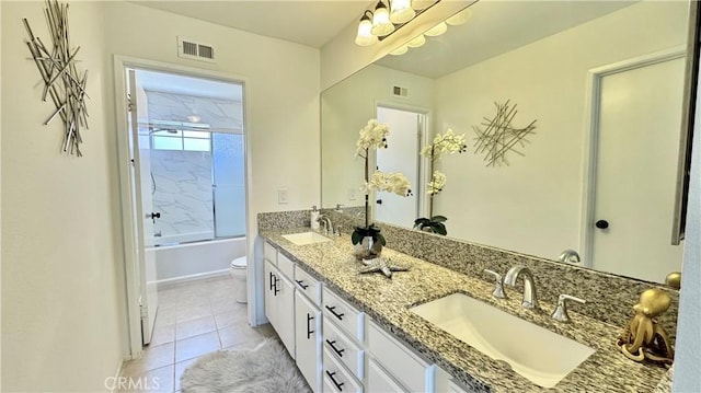 full bathroom featuring tile patterned floors, visible vents, toilet, and a sink
