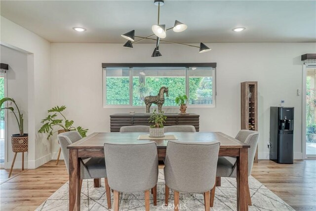 6054 N Kavanagh Ave, Fresno, CA 93711 - dining room with light wood-style flooring, baseboards, recessed lighting, and a healthy amount of sunlight
