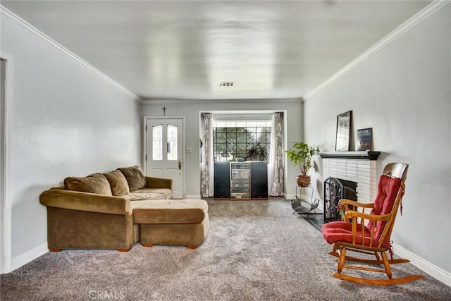 carpeted living room with baseboards, crown molding, and a brick fireplace