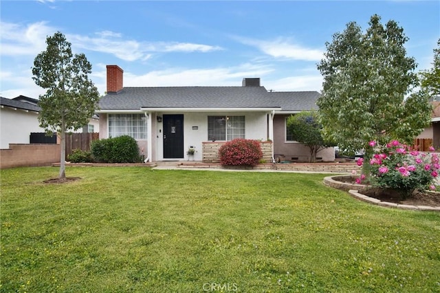 ranch-style home with a chimney and stucco siding