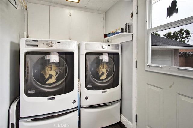 laundry area with separate washer and dryer