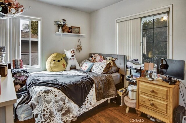 bedroom featuring wood finished floors